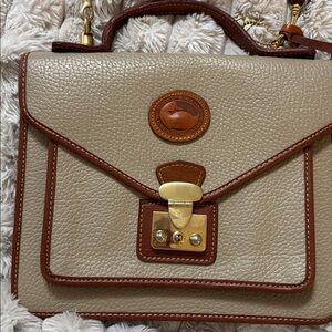 Dooney & Bourke All-Weather Leather crossbody satchel is a durable absolutely